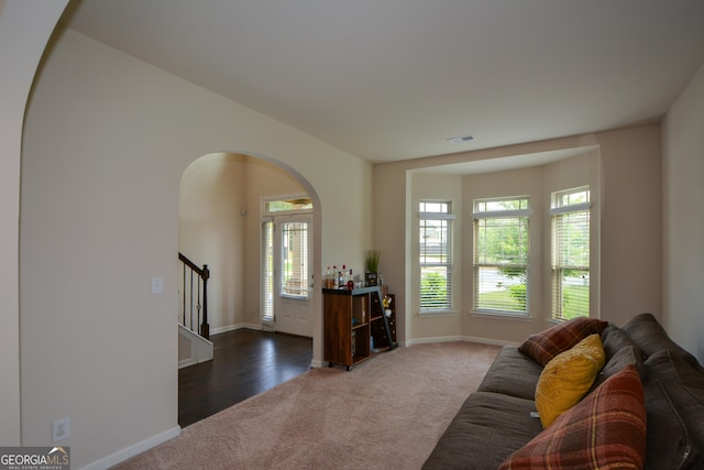 6816 Diamond Dr, Rex, GA 30273 - living area featuring carpet floors, stairway, plenty of natural light, and baseboards