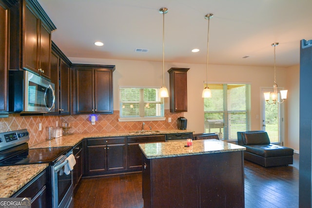 6816 Diamond Dr, Rex, GA 30273 - kitchen featuring stainless steel appliances, a sink, dark wood-style flooring, light stone countertops, and recessed lighting