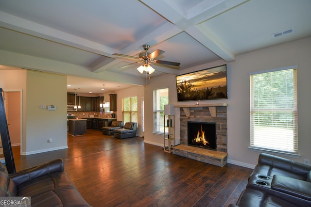 6816 Diamond Dr, Rex, GA 30273 - living room featuring dark wood finished floors, baseboards, a fireplace, beam ceiling, and ceiling fan