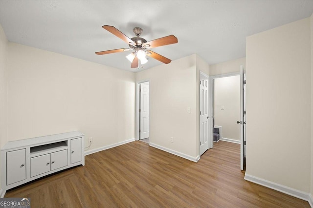 238 Chads Ford Way, Roswell, GA 30076 - unfurnished bedroom with wood finished floors and a ceiling fan