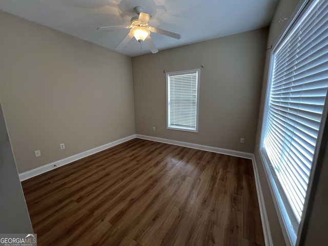 614 Cottage Ln, Lagrange, GA 30240 - empty room featuring visible vents, ceiling fan, dark wood finished floors, and baseboards