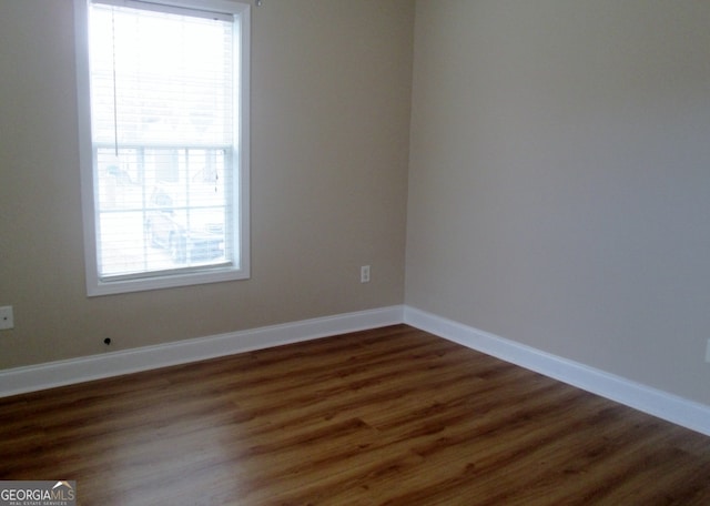 614 Cottage Ln, Lagrange, GA 30240 - unfurnished room with baseboards, ceiling fan, and dark wood-type flooring