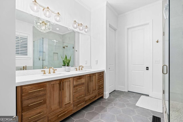 bathroom with ornamental molding, a shower stall, double vanity, tile patterned flooring, and a chandelier