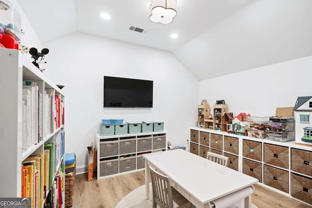 rec room featuring vaulted ceiling, wood finished floors, and recessed lighting