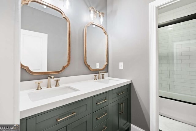 bathroom with double vanity and bath / shower combo with glass door