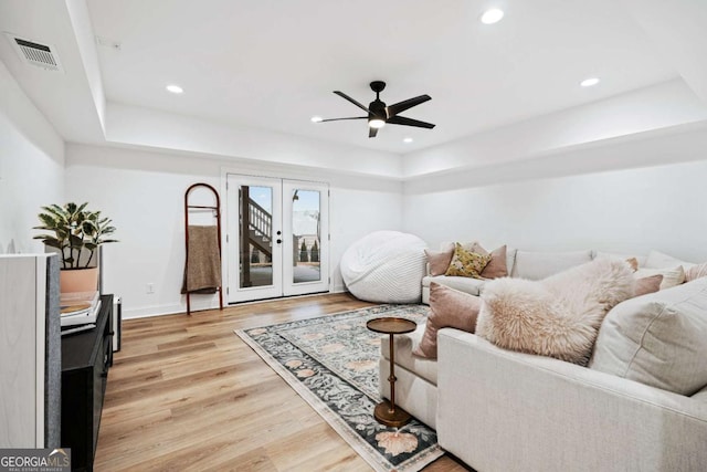 living room featuring light wood finished floors, ceiling fan, french doors, baseboards, and recessed lighting