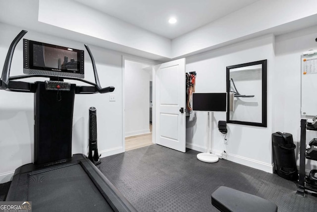 workout room featuring baseboards and recessed lighting