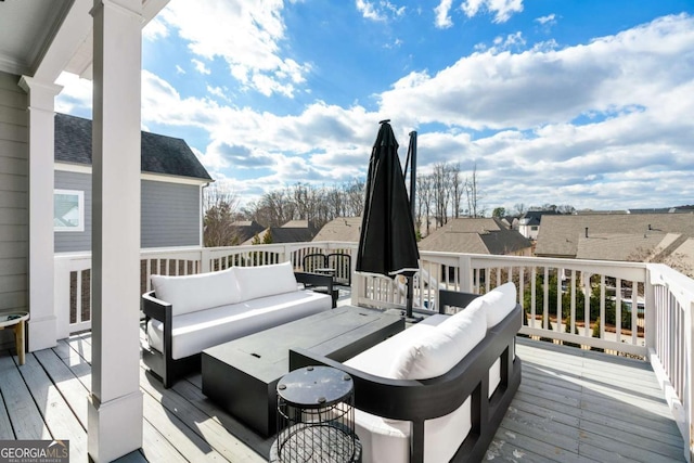 wooden deck with an outdoor hangout area