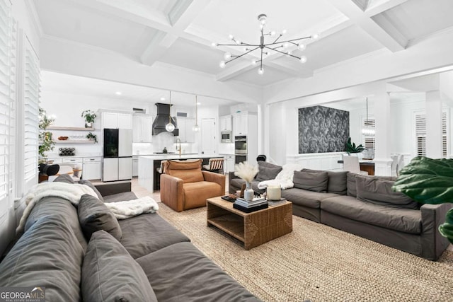living room with a chandelier, coffered ceiling, beam ceiling, a wainscoted wall, and ornamental molding