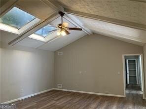 470 Ovara Ct, Stone Mountain, GA 30088 - bonus room featuring a skylight, dark wood-style floors, and a ceiling fan