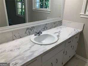 470 Ovara Ct, Stone Mountain, GA 30088 - bathroom with vanity and baseboards