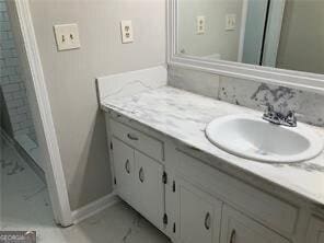 470 Ovara Ct, Stone Mountain, GA 30088 - bathroom with marble finish floor, vanity, and baseboards