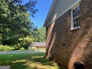 470 Ovara Ct, Stone Mountain, GA 30088 - view of home's exterior featuring brick siding and a yard