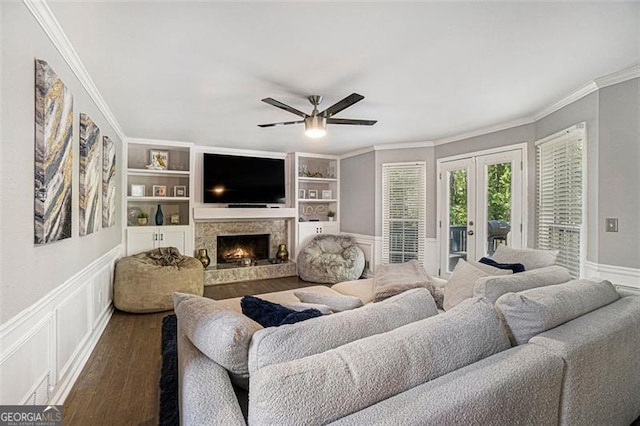 180 Spring Ridge Trce, Roswell, GA 30076 - living room with ornamental molding, ceiling fan, dark wood-style floors, a warm lit fireplace, and french doors