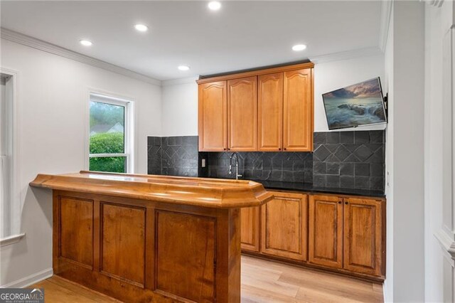 4030 Scenic View Ct, Cumming, GA 30028 - bar with light wood-style floors, ornamental molding, and backsplash