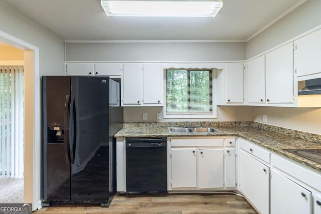 5802 Oakleaf Dr, Stone Mountain, GA 30087 - kitchen with a sink, white cabinetry, black appliances, and wood finished floors
