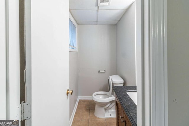 5802 Oakleaf Dr, Stone Mountain, GA 30087 - bathroom featuring toilet, baseboards, tile patterned flooring, vanity, and a paneled ceiling