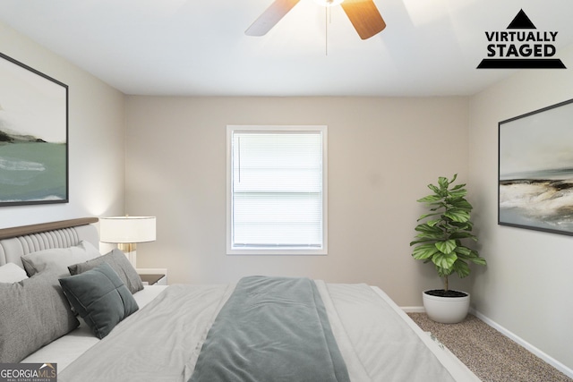 5802 Oakleaf Dr, Stone Mountain, GA 30087 - carpeted bedroom with baseboards and ceiling fan
