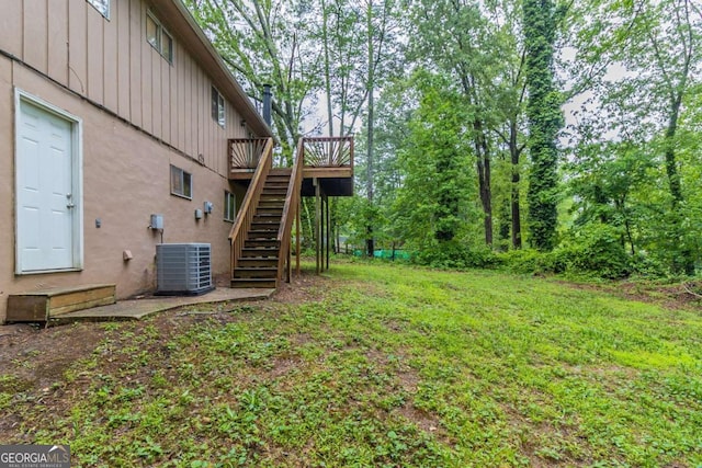 5802 Oakleaf Dr, Stone Mountain, GA 30087 - view of yard with central air condition unit, stairway, and a deck