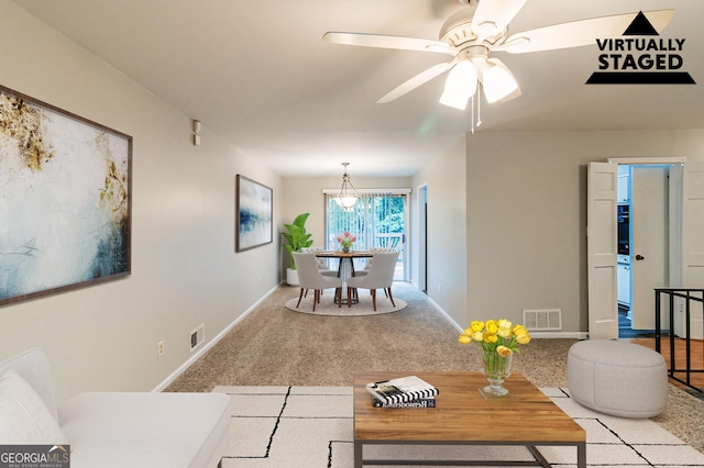 5802 Oakleaf Dr, Stone Mountain, GA 30087 - living area featuring baseboards, visible vents, and carpet floors
