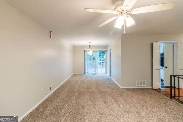 5802 Oakleaf Dr, Stone Mountain, GA 30087 - empty room with carpet flooring, visible vents, and baseboards