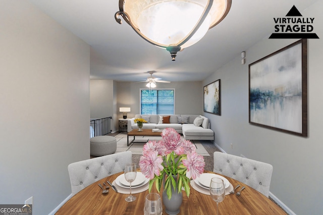 5802 Oakleaf Dr, Stone Mountain, GA 30087 - dining room with baseboards, a ceiling fan, and wood finished floors