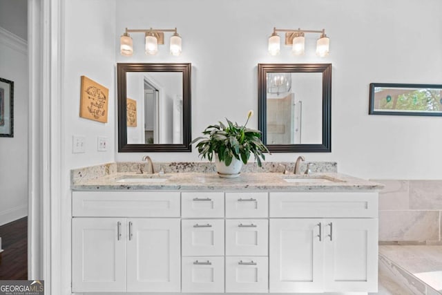 bathroom featuring double vanity and a sink
