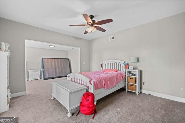 carpeted bedroom with visible vents, ceiling fan, and baseboards