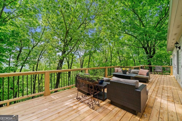wooden deck featuring outdoor lounge area