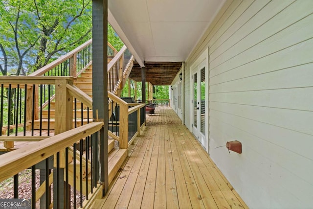 deck featuring french doors and stairs