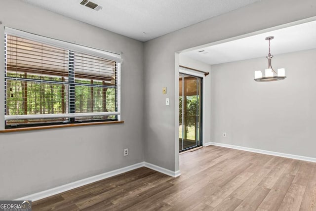 108 Ashwood Pt Unit 196, Eatonton, GA 31024 - empty room with healthy amount of natural light and wood finished floors