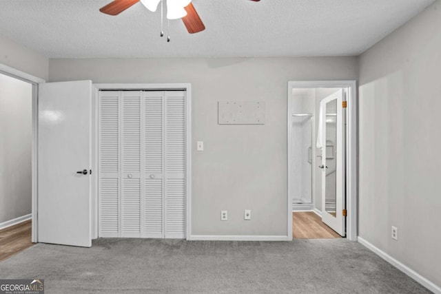 108 Ashwood Pt Unit 196, Eatonton, GA 31024 - unfurnished bedroom featuring a closet, carpet flooring, a textured ceiling, a ceiling fan, and ensuite bathroom