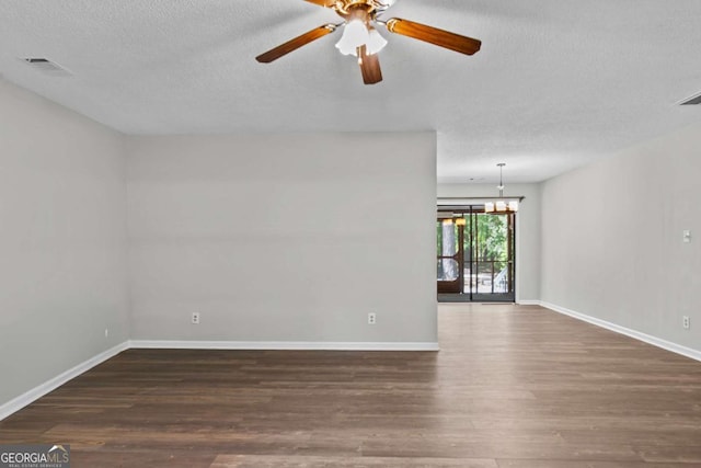 108 Ashwood Pt Unit 196, Eatonton, GA 31024 - spare room featuring wood finished floors, a textured ceiling, ceiling fan, and a chandelier