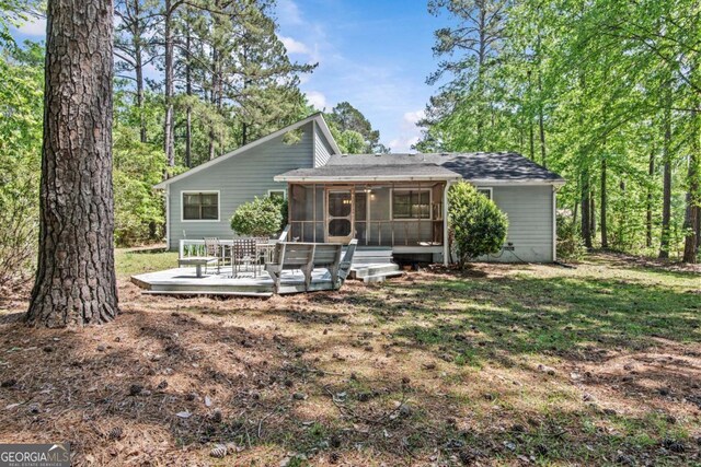 108 Ashwood Pt Unit 196, Eatonton, GA 31024 - view of front of property with a sunroom, a deck, and roof with shingles