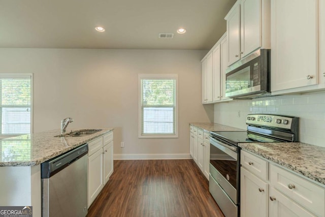 392 Dublin Way, Dallas, GA 30132 - kitchen featuring a sink, dark wood-type flooring, visible vents, white cabinetry, and appliances with stainless steel finishes