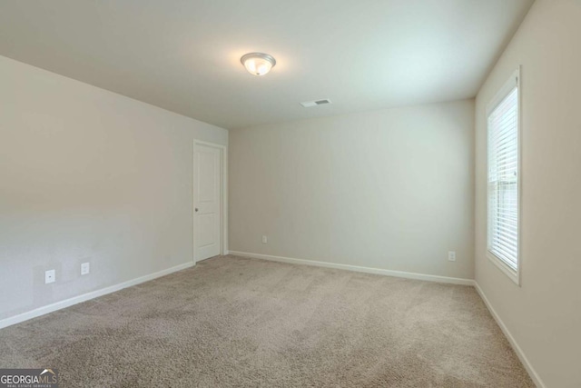 392 Dublin Way, Dallas, GA 30132 - spare room featuring carpet, a healthy amount of sunlight, and baseboards