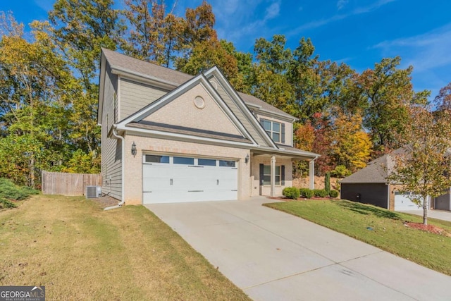 392 Dublin Way, Dallas, GA 30132 - traditional home with brick siding, fence, driveway, a front yard, and an attached garage