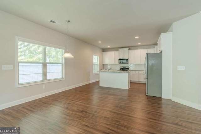 392 Dublin Way, Dallas, GA 30132 - kitchen featuring dark wood-style flooring, visible vents, white cabinets, appliances with stainless steel finishes, and open floor plan