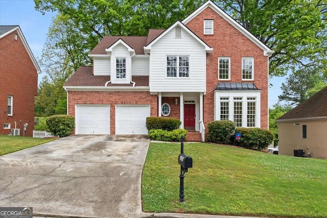 traditional-style house with concrete driveway, central AC unit, a front yard, and brick siding
