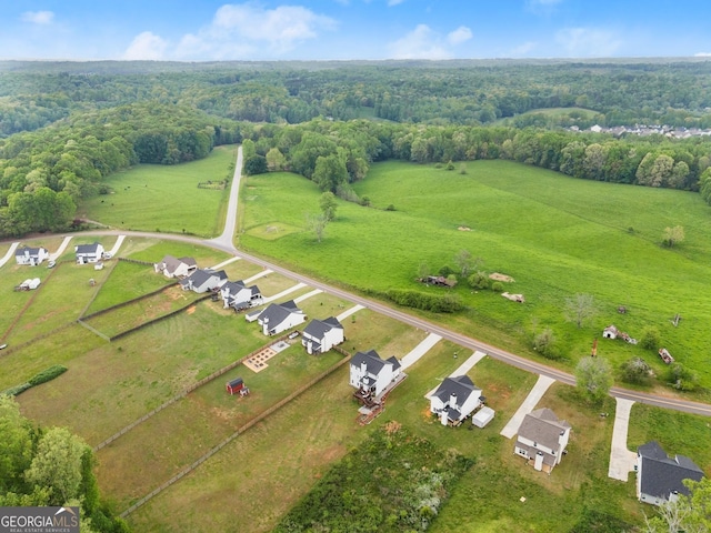 bird's eye view with a rural view and a forest view