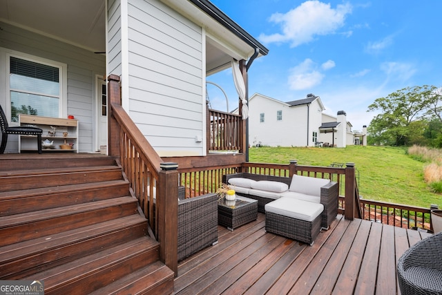wooden deck with outdoor lounge area and a lawn