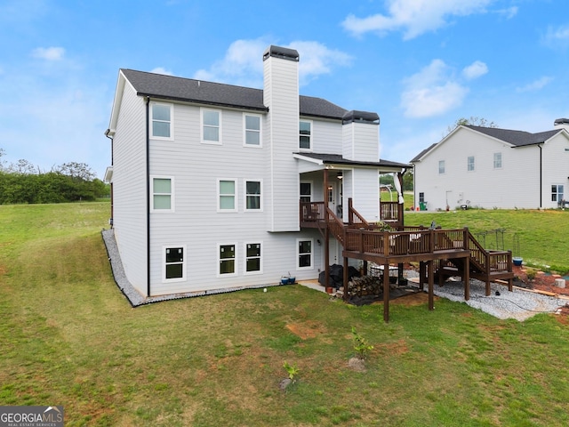 rear view of property featuring stairway, a deck, a yard, and a chimney
