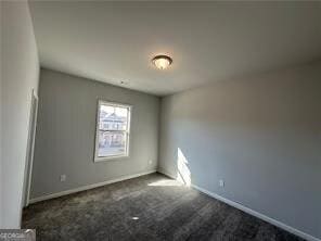 3421 Andover Way, Buford, GA 30519 - unfurnished room with baseboards and dark colored carpet