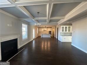 3421 Andover Way, Buford, GA 30519 - unfurnished living room featuring dark wood-style flooring, a fireplace, baseboards, beamed ceiling, and coffered ceiling