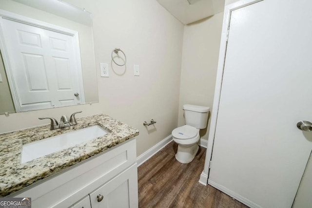 4442 Mercer Rd, Decatur, GA 30035 - half bath with baseboards, wood finished floors, toilet, and vanity