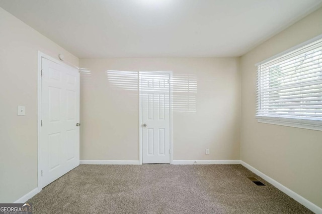 4442 Mercer Rd, Decatur, GA 30035 - unfurnished bedroom with carpet flooring, baseboards, and visible vents