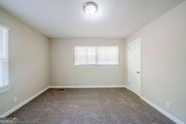 4442 Mercer Rd, Decatur, GA 30035 - spare room featuring carpet, visible vents, and baseboards