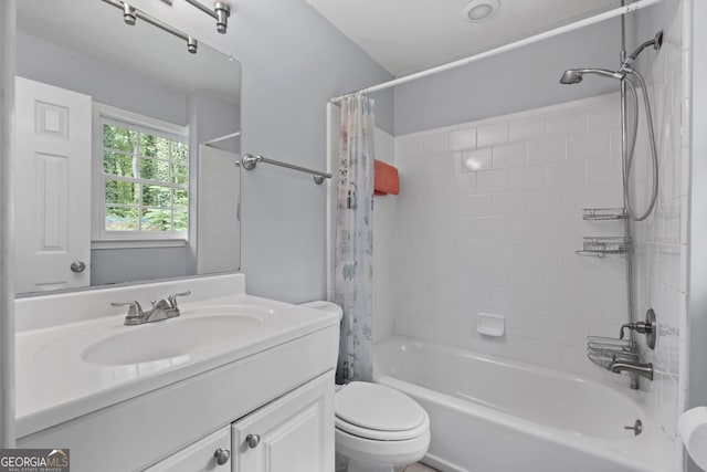 bathroom with vanity, toilet, and shower / tub combo with curtain