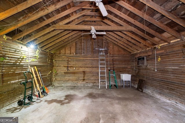 unfinished attic featuring a sink