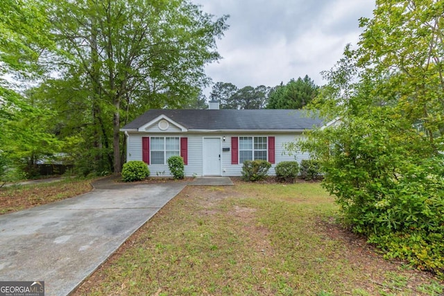 8051 Trinity Park Dr, Riverdale, GA 30296 - view of front of property featuring a chimney, driveway, and a front lawn